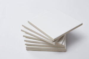 White,Tiles,Stacked,Against,A,White,Background